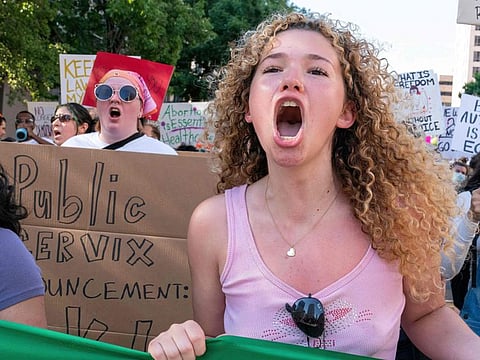 An abortion rights demonstrator chants slogans as they march near the State Capitol in Austin on June 25, 2022.