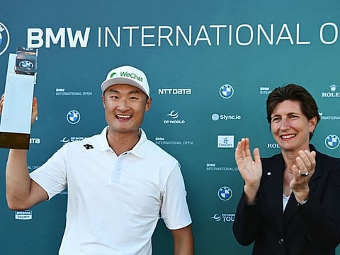 Haotong Li (China) receiving his BMW International Open trophy.
