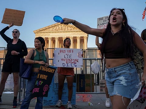 Abortion rights demonstrators protest the day after the United States Supreme Court ruled in the Dobbs v Women's Health Organization abortion case, overturning the landmark Roe v Wade abortion decision, in Washington, on June 25, 2022.