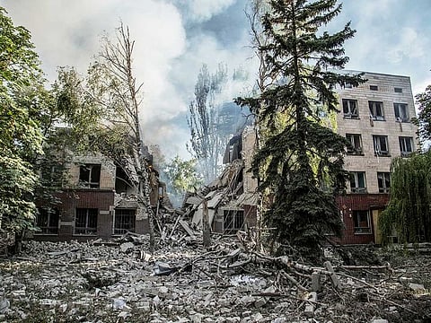 Smoke rises over the remains of a building destroyed by a military strike, as Russia's attack on Ukraine continues, in Lysychansk, Luhansk region, Ukraine June 17, 2022.