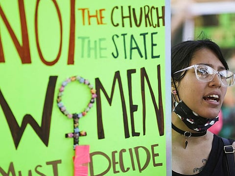Belkis Pena, 19, holds a sign as abortion rights protesters demonstrate after the U.S. Supreme Court ruled in the Dobbs v Women’s Health Organization abortion case, overturning the landmark Roe v Wade abortion decision in Los Angeles, California, U.S., June 27, 2022.
