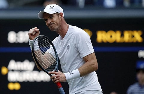 Britain's Andy Murray celebrates winning his men's singles tennis match against Australia's James Duckworth on the first day of the 2022 Wimbledon Championships at The All England Tennis Club in Wimbledon, southwest London.