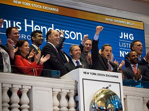 Richard Weil, center left, and Andrew Formica, center, on the floor of the New York Stock Exchange.