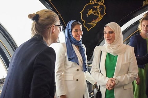 Noora Al Abbar and Hala Badri during discussion with a British delegate at the networking event in UK.