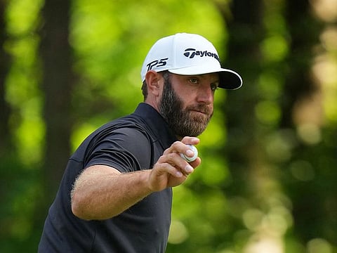 Two-time major winner Dustin Johnson of US lies one stroke behind in second spot with five birdies and bogey on hole 18.