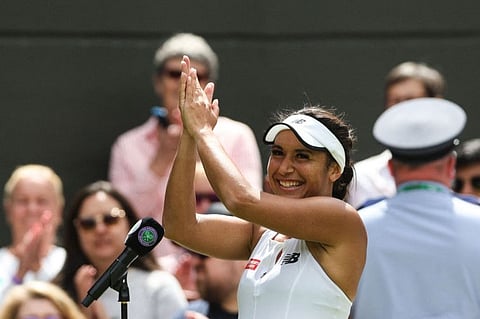 Britain's Heather Watson celebrates as she speaks during an interview after winning against Slovenia's Kaja Juvan at The All England Tennis Club in Wimbledon on Friday.