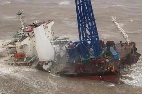 This handout photo taken and released by the Hong Kong Government Flying Service on July 2, 2022 shows a ship after it broke into two amid Typhoon Chaba, during a rescue operation of the crew members in the South China Sea 160 nautical miles southwest of Hong Kong.