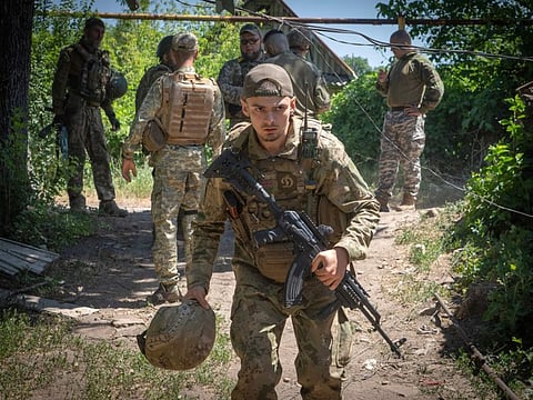 Ukrainian soldiers attend their positions, in the Donetsk region, Ukraine, Saturday, July 2, 2022.