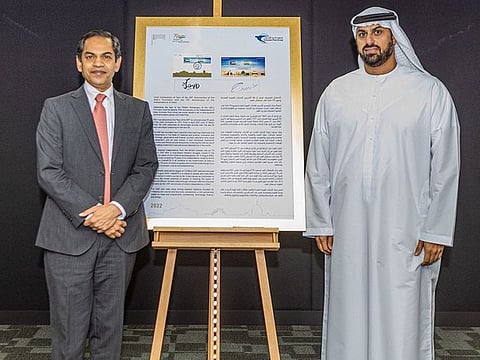 Abdulla M. Alashram, Group CEO of Emirates Post Group, right, launched the stamp by presenting it to Sunjay Sudhir, Ambassador of India to UAE.