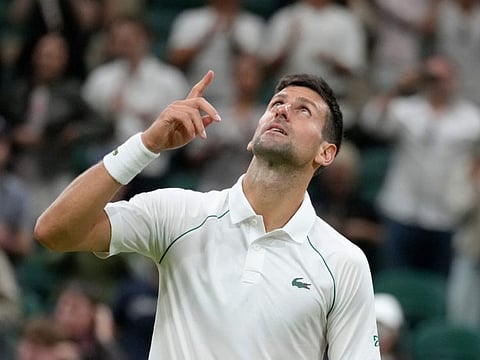 Serbia's Novak Djokovic celebrates after defeating Tim van Rijthoven of the Netherlands in the men's fourth round on day seven of the Wimbledon Championships in London on Sunday.