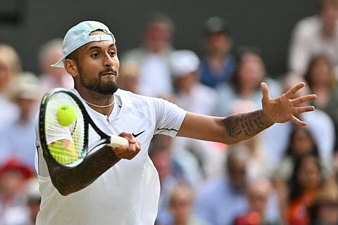 Australia's Nick Kyrgios returns the ball to American Brandon Nakashima during their men's singles round of 16 at the Wimbledon Championships on Monday.