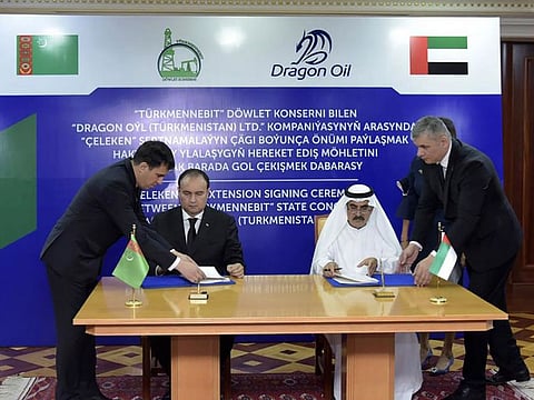 Officials from Dragon Oil and Turkmenistan sign the 10-year, $1 billion deal extension.
