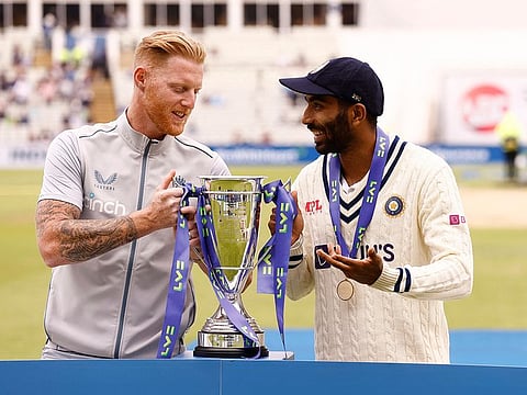 Sharing the spoils: Rival skippers Ben Stokes (left) and Jasprit Bumrah pose with the trophy as the five-Test series eventually ended 2-2.