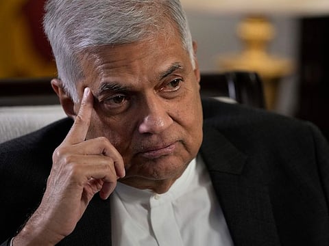 Sri Lanka's new prime minister Ranil Wickremesinghe gestures during an interview with The Associated Press in Colombo, Sri Lanka, June 11, 2022.
