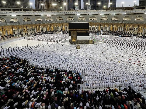 Worshippers pray around the Kaaba, Islam's holiest shrine, at the Grand Mosque in Mecca on July 6, 2022.