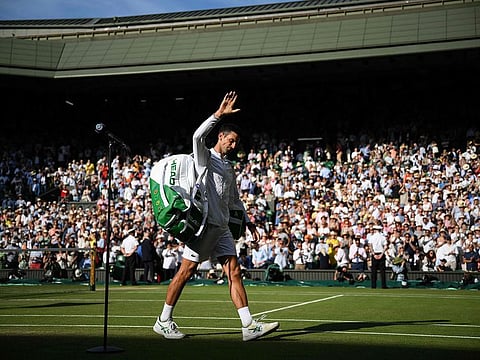 Landmarks beckon: Novak Djokovic acknowledges cheers from the crowd after making it to his eighth final at the Wimbledon.