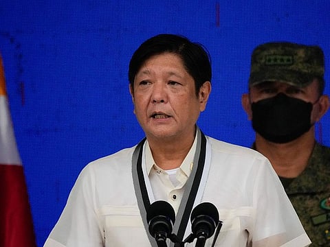 President-elect Ferdinand Marcos Jr., left, talks during the Presidential Security Group Change of Command ceremony on Monday, July 4, 2022, in Manila, Philippines.