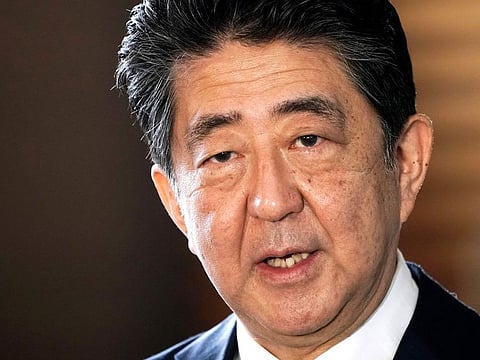 Shinzo Abe speaks to the media in Tokyo on September 16, 2020. A former prime minister and one of Japan’s most powerful and influential figures, Abe died after being shot during a campaign speech in western Japan on July 8, 2022.