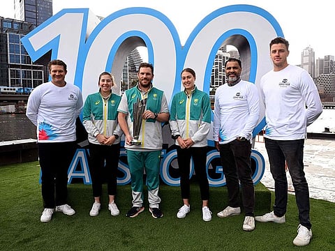 100 days to go: Australia's T20 captain Aaron Finch (third left) holds the World Cup trophy with former international players Shane Watson (left), Waqar Younis (second right), Morne Morkel (right) and Australian women's players Georgia Wareham second left) and Tayla Vlaeminck (third right) at the ICC Men’s T20 World Cup 2022 100 days-to-go ceremony in Melbourne on Friday.