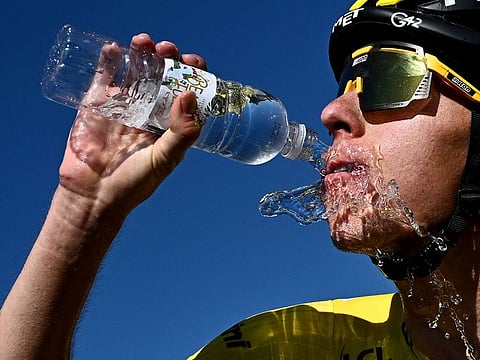 Uae Team Emirates' Tadej Pogacar, wearing the overall leader's yellow jersey, refreshes after winning seventh stage of Tour de France on Friday.