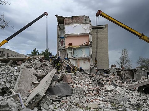 Rescuers clear the scene after a building was partially destroyed as a result of Russian missile hit on a four-storey residential building in Chasiv Yar, Bakhmut District, eastern Ukraine, on July 10.
