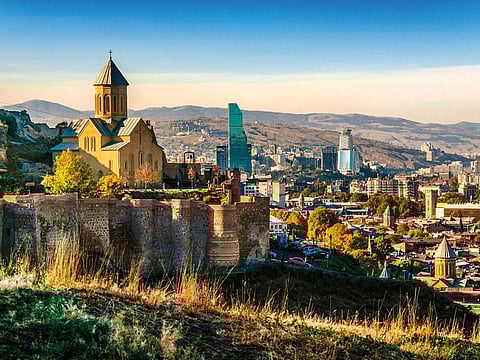 View of Narikala fortress in Tbilisi, the capital of Georgia. Singles and young couples who want a quick getaway are looking at destinations without visa requirements, such as Georgia and Azerbaijan.