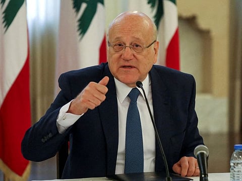 Lebanese Prime Minister Najib Mikati gestures during a news conference at the government palace in Beirut in a file photo.