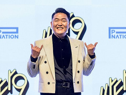 South Korean singer Psy poses as he arrives at a press conference to promote his ninth album “Psy 9th" at a hotel in Seoul on April 29, 2022.