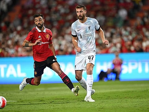Manchester United's Bruno Fernandes (left) and Liverpool's Nathaniel Phillips vie for the ball during their exhibition football match in Bangkok on Tuesday.