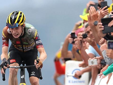 Jumbo-Visma team's Danish rider Jonas Vingegaard cycles to the finish line to win the 11th stage of the 109th edition of the Tour de France cycling race, 151,7 km between Albertville and Col du Granon Serre Chevalier, in the French Alps.