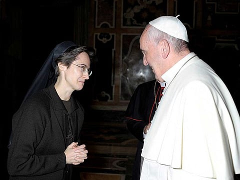Italian nun Sister Raffaella Petrini, who is the first woman to be appointed as the number two position in the governorship of Vatican City, is greeted by Pope Francis in this undated handout photo released by the Vatican on November 5, 2021.