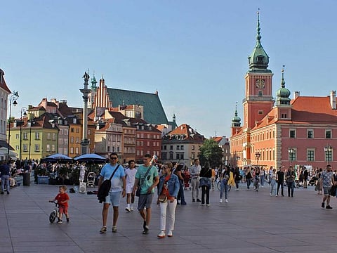The historic Castle Square of Warsaw. The Royal Castle (right), which housed Polish monarchs, is now a museum, and the Sigimund Column can be seen across it. The buildings and castle were destroyed in the World Wars, but were rebuilt.
