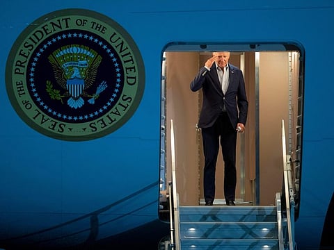 President Joe Biden returns a salute as he boards Air Force One for a trip to Israel and Saudi Arabia on July 12, 2022, at Andrews Air Force Base, Maryland.
