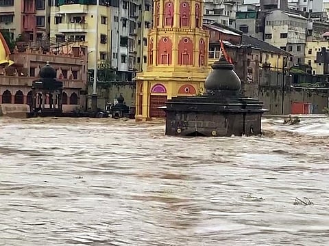 Temples submerged under the waters of Godavari river due to heavy rainfall for the past three days, in Nashik on Monday, July 11, 2022.