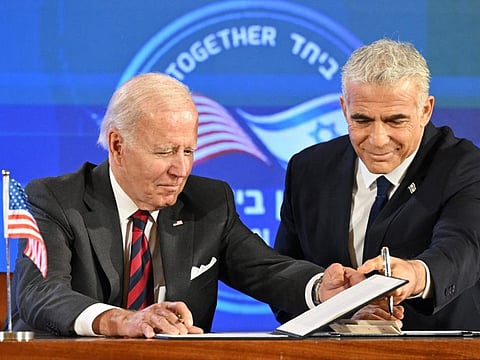 US President Joe Biden and Israel's Prime Minister Yair Lapid, sign a security pledge in Jerusalem, on July 14, 2022.