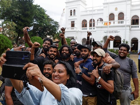 Protestors take a selfie before vacating the Sri Lanka's Prime Minister Ranil Wickremesinghe's office, amid the country's economic crisis, in Colombo, Sri Lanka July 14, 2022.