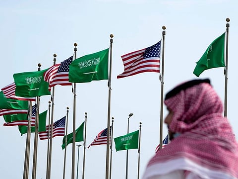 American and Saudi Arabian flags prior to a visit by US President Joe Biden, at a square in Jeddah, Saudi Arabia, on July 14, 2022.