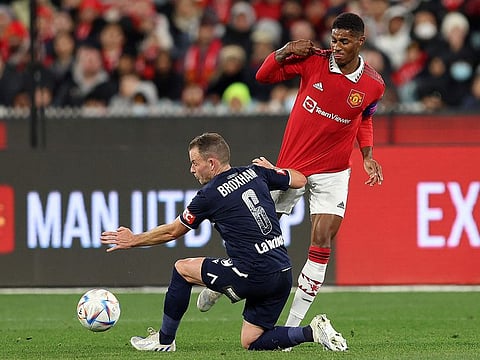 Marcus Rashford (right) of Manchester United is challenged by Leigh Broxham of Melbourne Victory during their exhibition match at the Melbourne Cricket Ground on Friday.