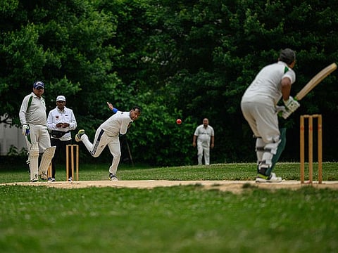 A bowler bowls during a cricket match at the Staten Island Cricket Club last month. The New York one club is celebrating 150 years thanks to the city's large immigrant communities.
