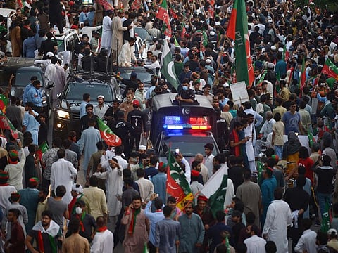 Supporters of the opposition party Pakistan Tehreek-e-Insaf (PTI) march during a protest rally against inflation, 'political destabilisation' in Rawalpindi in a file photo.