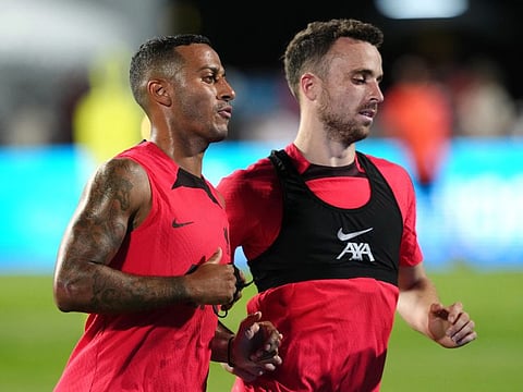 Liverpool's Diogo Jota (right) and Thiago Alcantara during training.