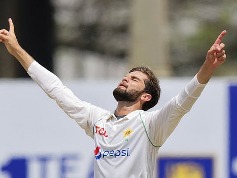Pakistan's Shaheen Shah Afridi celebrates the wicket of Sri Lanka's Niroshan Dikwella during the first day of the first Test in Galle, Sri Lanka.