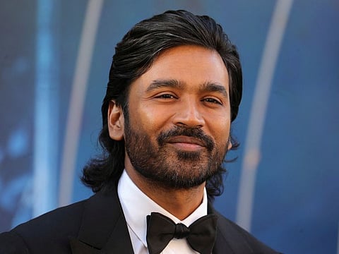 Dhanush poses on the red carpet before the World Premiere of Netflix's "The Gray Man" at TCL Chinese Theatre in Los Angeles, California.