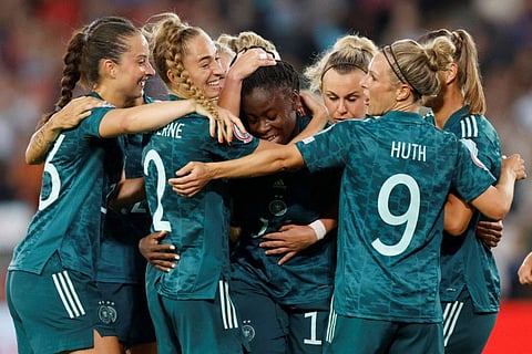 Germany's Nicole Anyomi celebrates scoring their third goal with teammates.