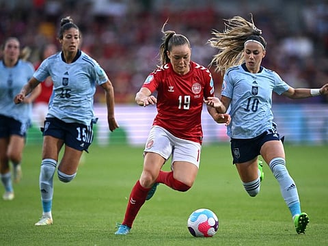 Spain's striker Athenea del Castillo (right) vies with Denmark's midfielder Janni Thomsen during the UEFA Women's Euro 2022 Group B football match at Brentford Community Stadium in west London.