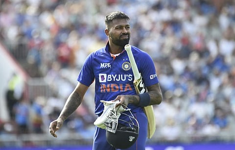 India's Hardik Pandya returns to the pavilion after being dismissed by England's Brydon Carse during the third one day international cricket match at Emirates Old Trafford cricket ground in Manchester, England.
