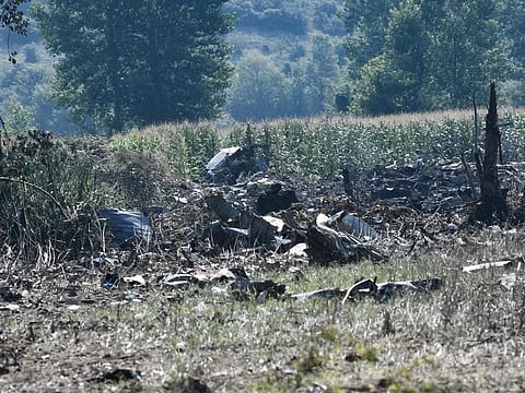 This picture taken on July 17, 2022, shows debris on the crash site of an Antonov An-12 cargo aircraft a few kilometers away from the city of Kavala in Greece.