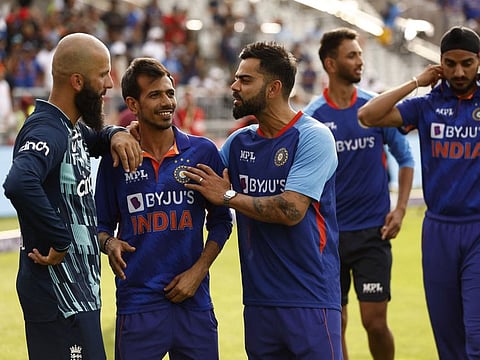 India's Virat Kohli talks (right) with England's Moeen Ali (left) after winning the One Day International Series at Old Trafford Cricket Ground, Manchester, Britain.