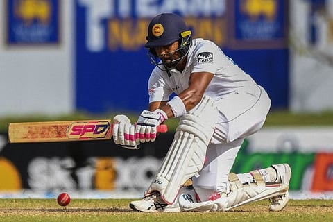 Sri Lanka's Dinesh Chandimal plays a sweep during the third day of play of the first Test against Sri Lanka in Galle on Monday.