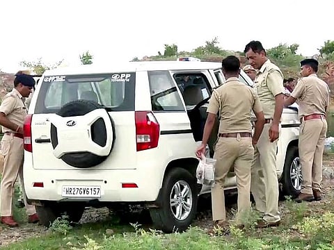Police collect evidence from the site where Tawadu (Mewat) DSP Surendra Singh Bishnoi, who had gone to investigate an instance of illegal mining, died after being allegedly run over by a dumper driver, in Nuh on Tuesday, July 19, 2022.